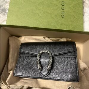 Gucci Black Pebbled Leather Clutch with Silver Accent